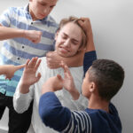 Teenagers bullying their classmate indoors